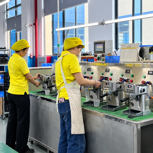 YSELE workers performing one-by-one production inspection and functional testing on espresso machines
